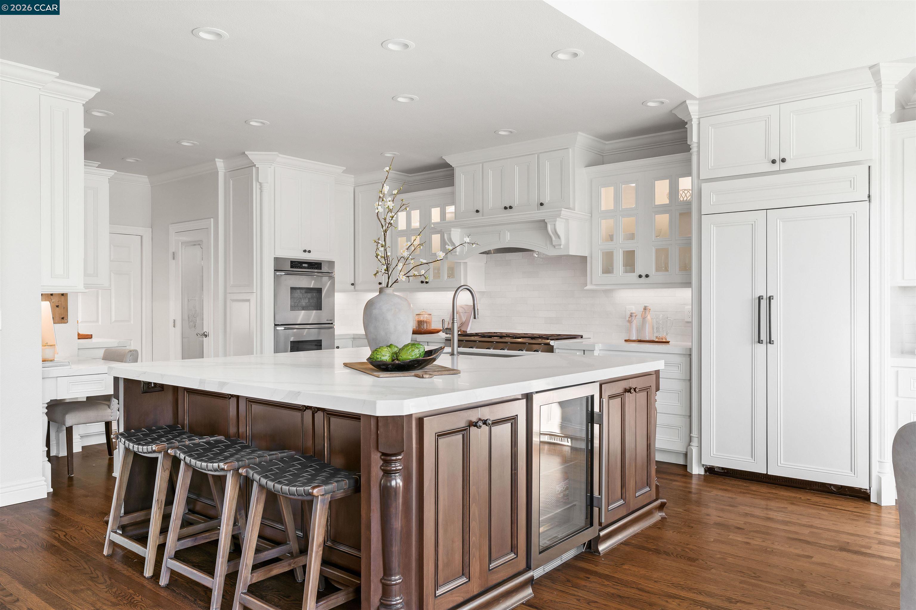 138 Sunhaven Road Danville, CA 94506 - Photo 17 of 60 a kitchen with stainless steel appliances a table chairs in it and wooden floor
