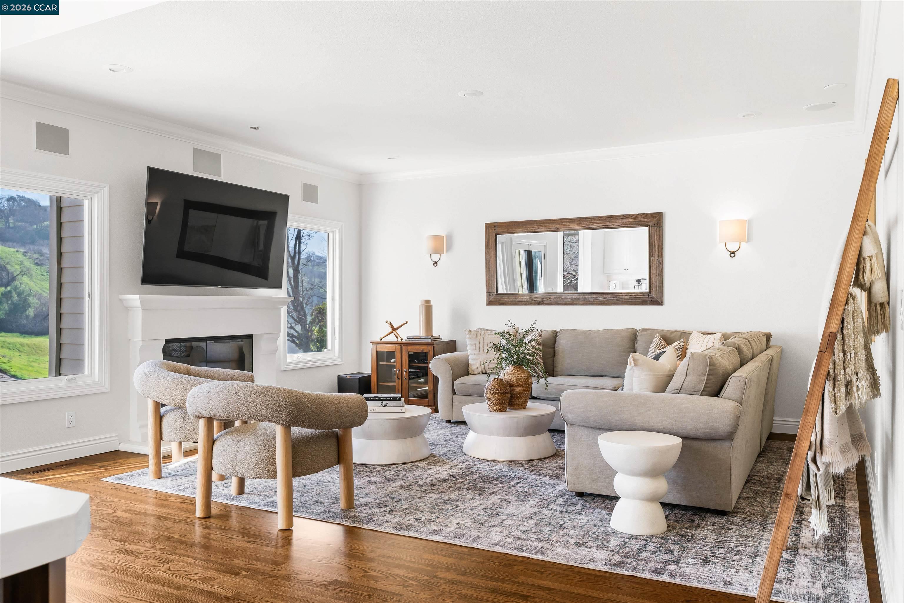 138 Sunhaven Road Danville, CA 94506 - Photo 25 of 60 a living room with furniture a flat screen tv and a fireplace