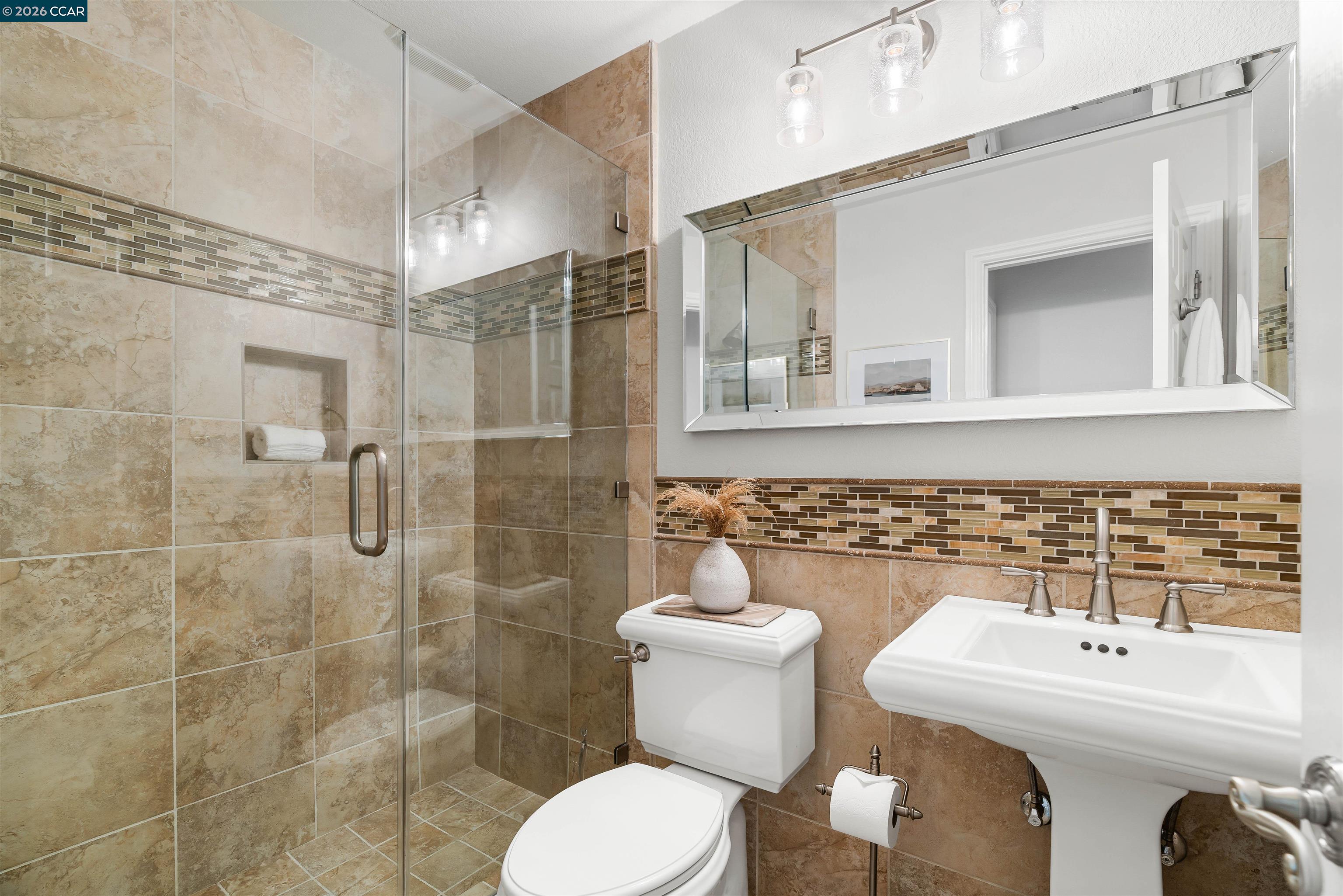 138 Sunhaven Road Danville, CA 94506 - Photo 29 of 60 a bathroom with a sink toilet a mirror and shower