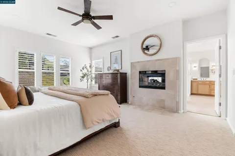 a view of a lake with couches and city view