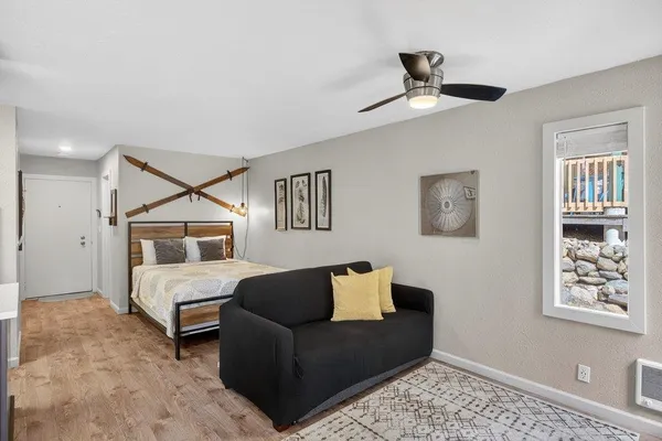 a bedroom with furniture and a window