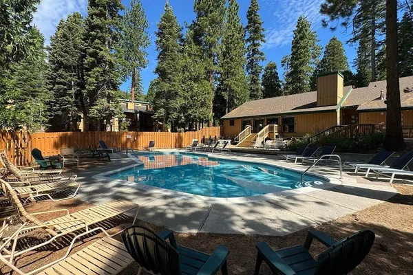 a view of backyard with trampoline
