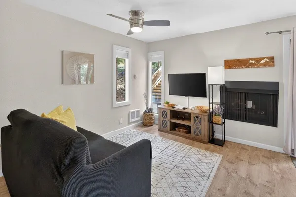 a living room with furniture and a flat screen tv