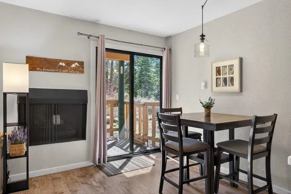 a view of a dining room with furniture window and outside view