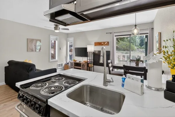 a kitchen with a stove and a refrigerator