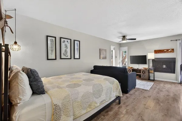 a bedroom with a bed and a flat screen tv