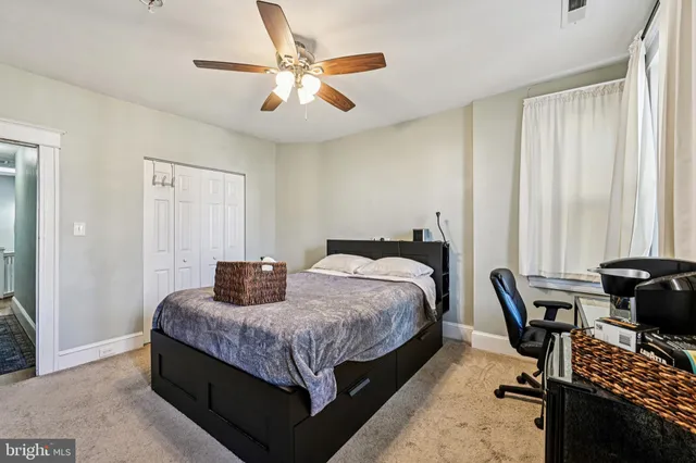 a bedroom with a bed furniture and a window