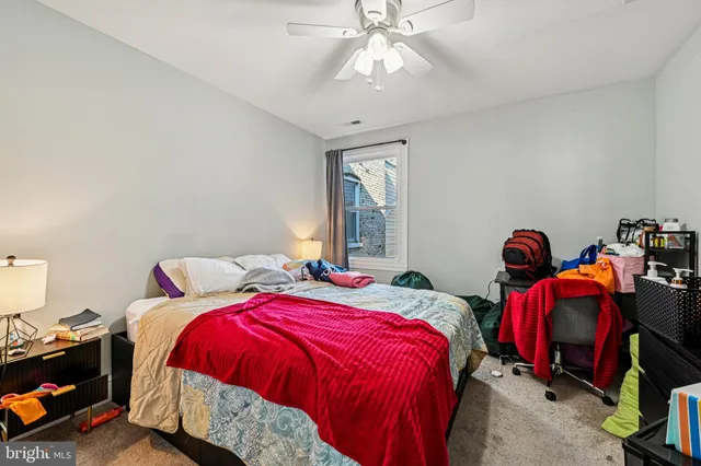 a bedroom with bed and window