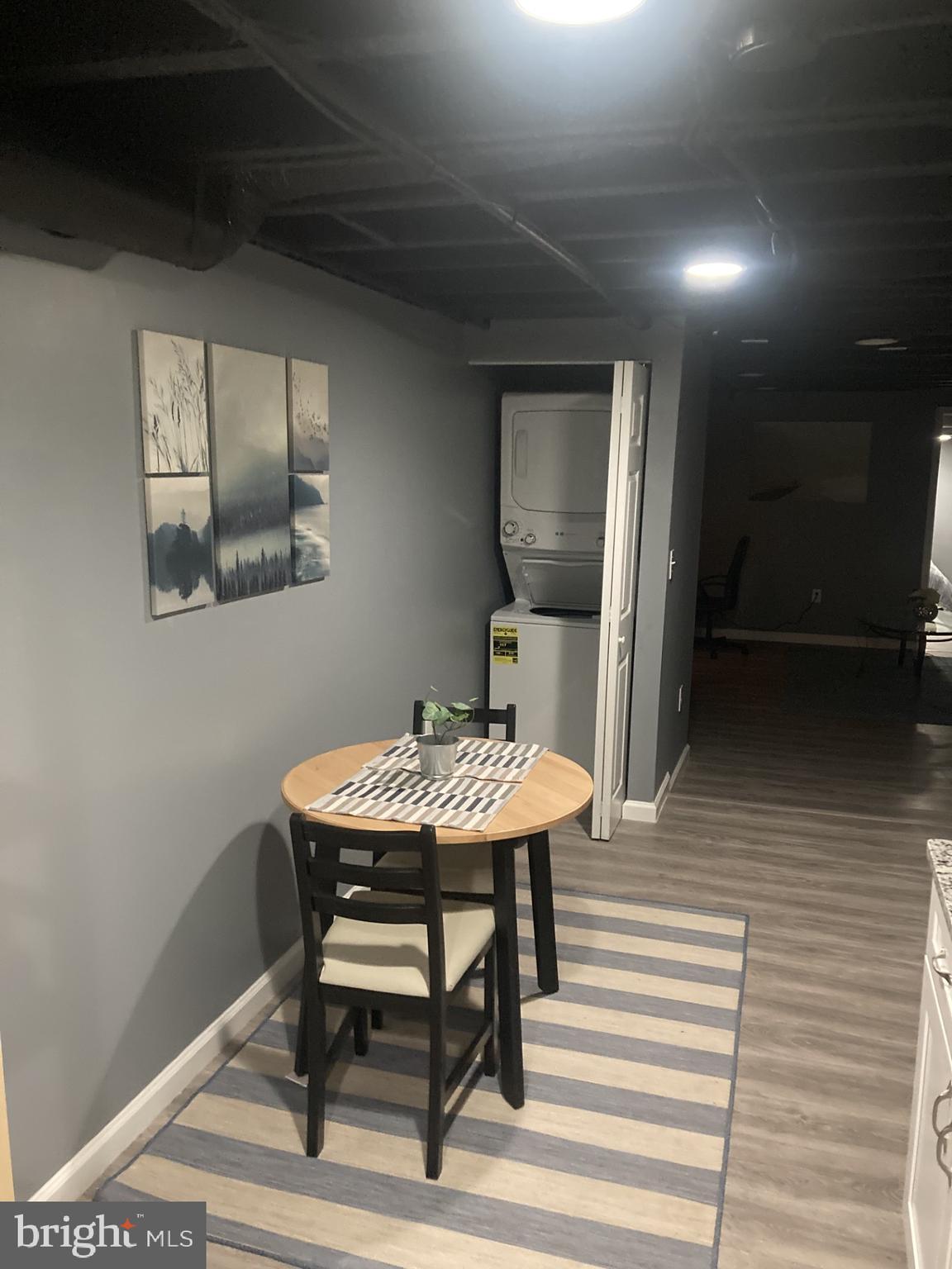 616 East 33rd Street Baltimore, MD 21218 - Photo 33 of 44 a view of a room with furniture and wooden floor
