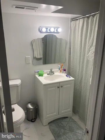 a balcony with table and chairs