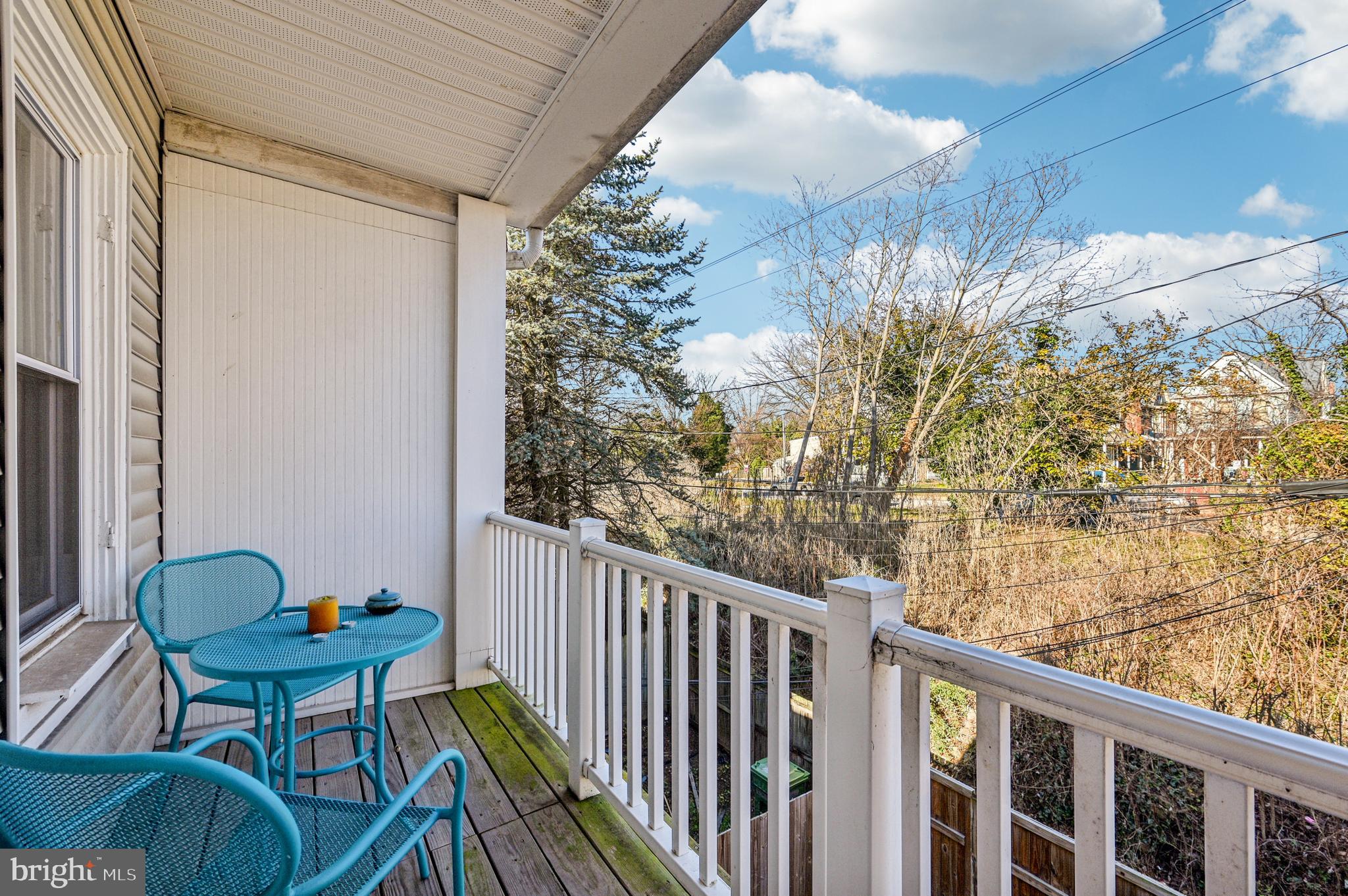 616 East 33rd Street Baltimore, MD 21218 - Photo 37 of 44 a balcony with table and chairs