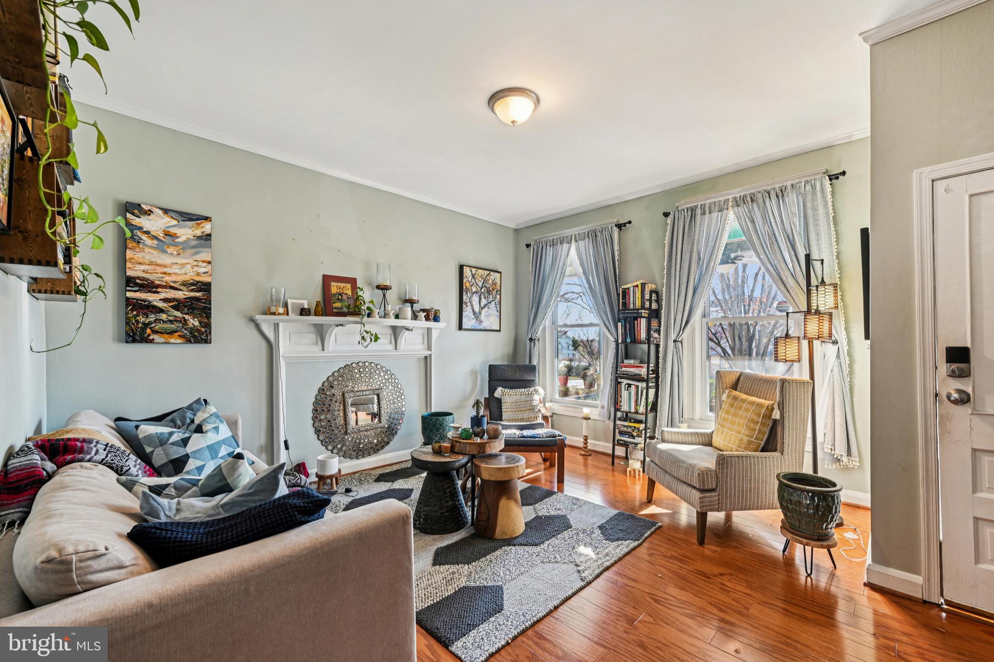 616 East 33rd Street Baltimore, MD 21218 - Photo 7 of 44 a living room with furniture and a wooden floor