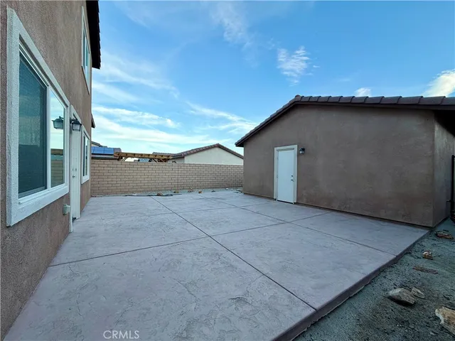 a view of house with backyard