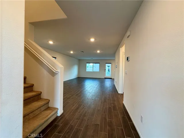 a view of entryway with wooden floor