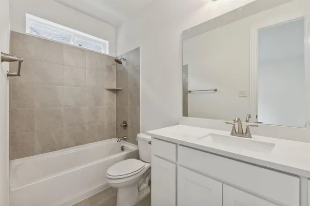 a bathroom with a sink a toilet and a bathtub