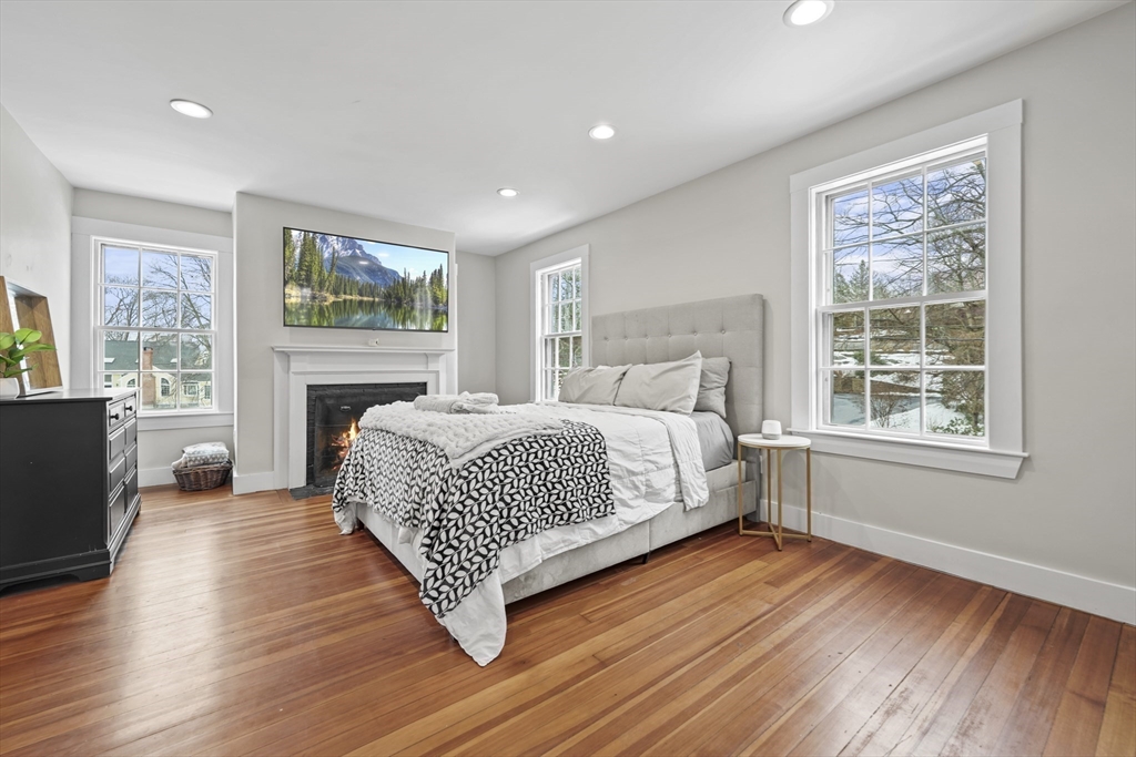 40 Haskell Street Beverly, MA 01915 - Photo 12 of 38 a bedroom with a large bed and a window