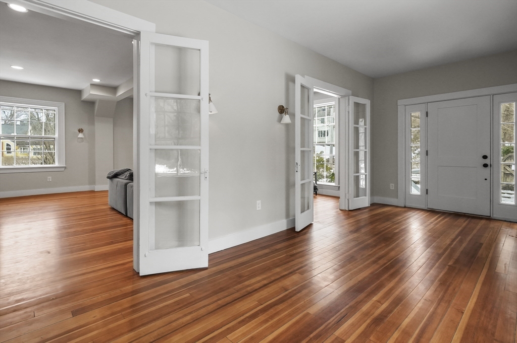 40 Haskell Street Beverly, MA 01915 - Photo 2 of 38 an empty room with wooden floor and windows