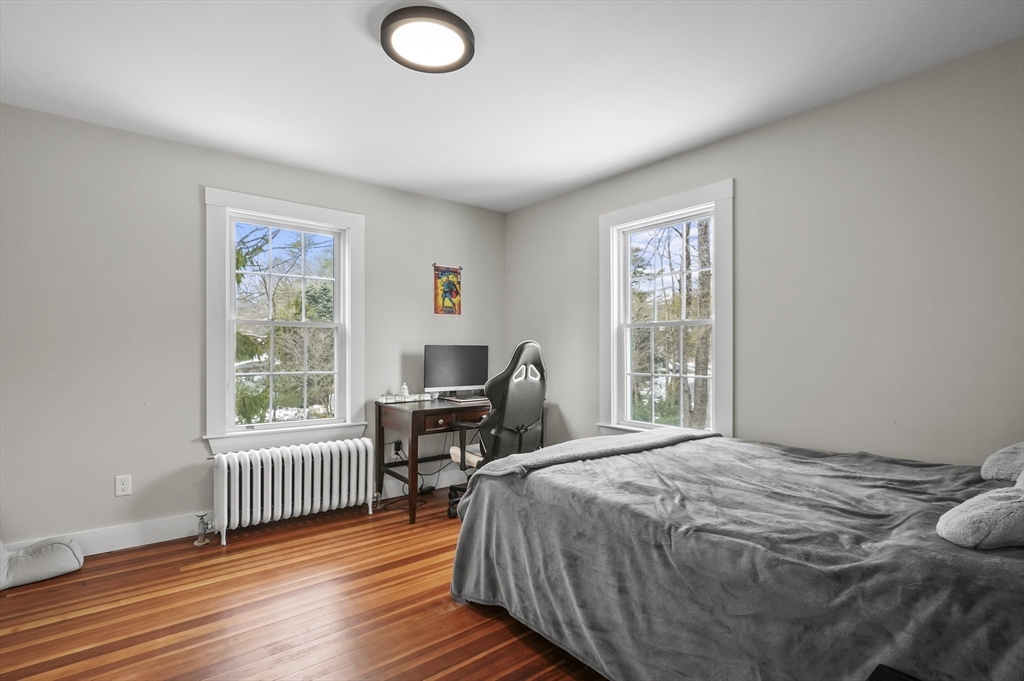 40 Haskell Street Beverly, MA 01915 - Photo 22 of 38 a bedroom with a bed and a window