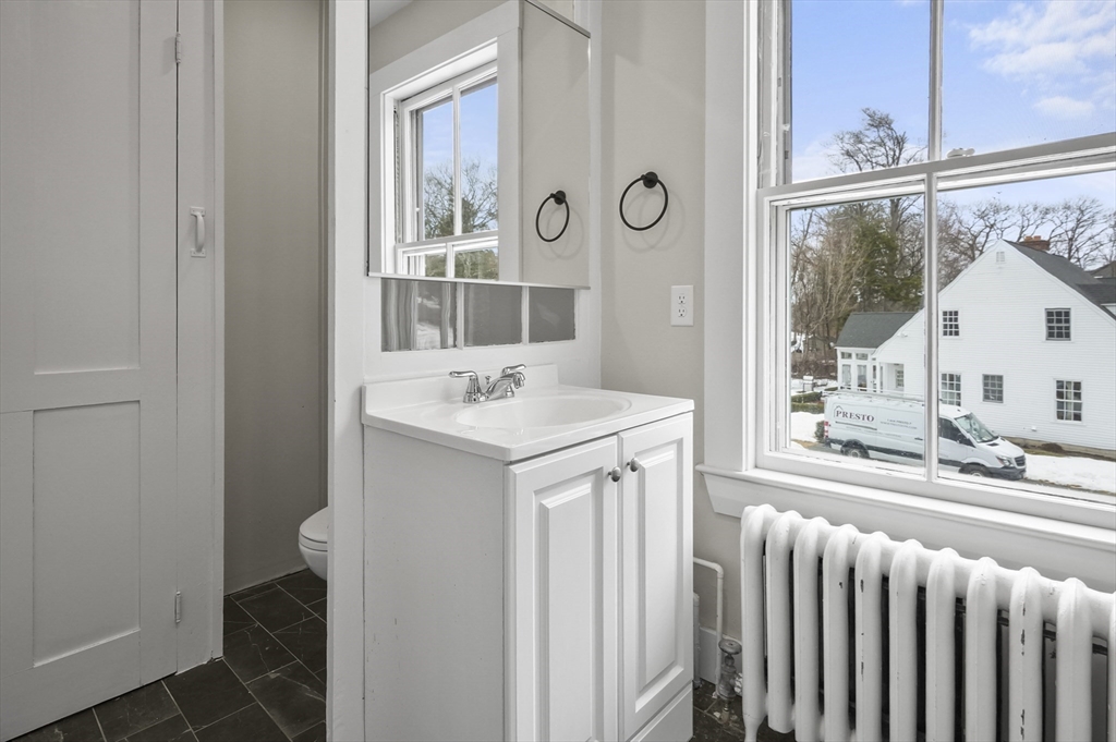 40 Haskell Street Beverly, MA 01915 - Photo 24 of 38 a bathroom with a sink and a window