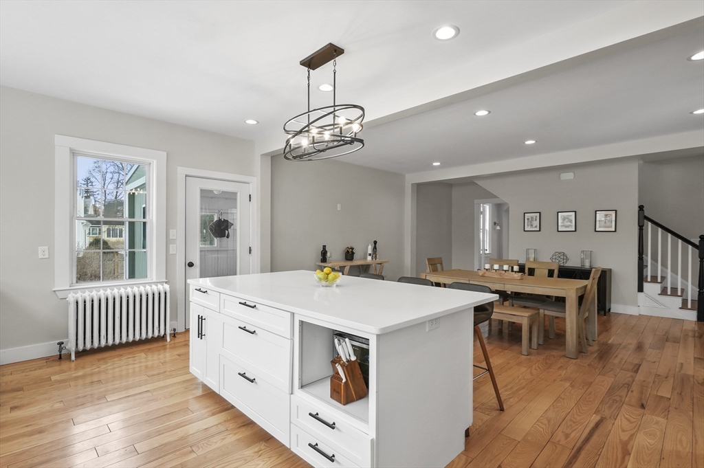 40 Haskell Street Beverly, MA 01915 - Photo 10 of 38 a large kitchen with a table and chairs