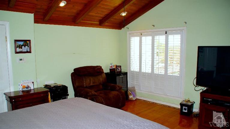 4534 Adam Road Simi Valley, CA 93063 - Photo 40 of 65 a bedroom with furniture and a window
