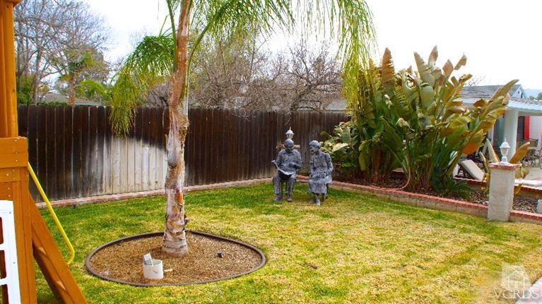 4534 Adam Road Simi Valley, CA 93063 - Photo 50 of 65 a backyard of a house with table and chairs
