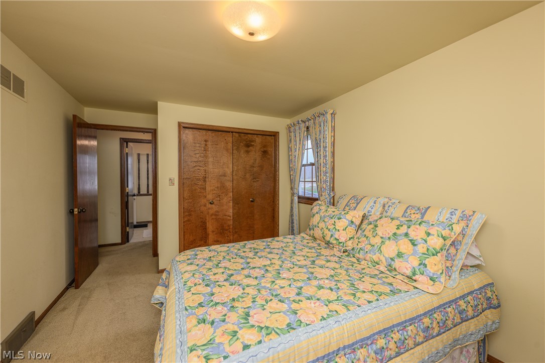 3724 Shellhart Road Barberton, OH 44203 - Photo 26 of 32 Bedroom featuring a closet and carpet flooring