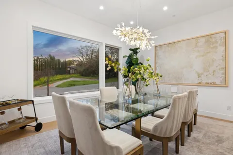a kitchen with a sink a counter top space and stainless steel appliances