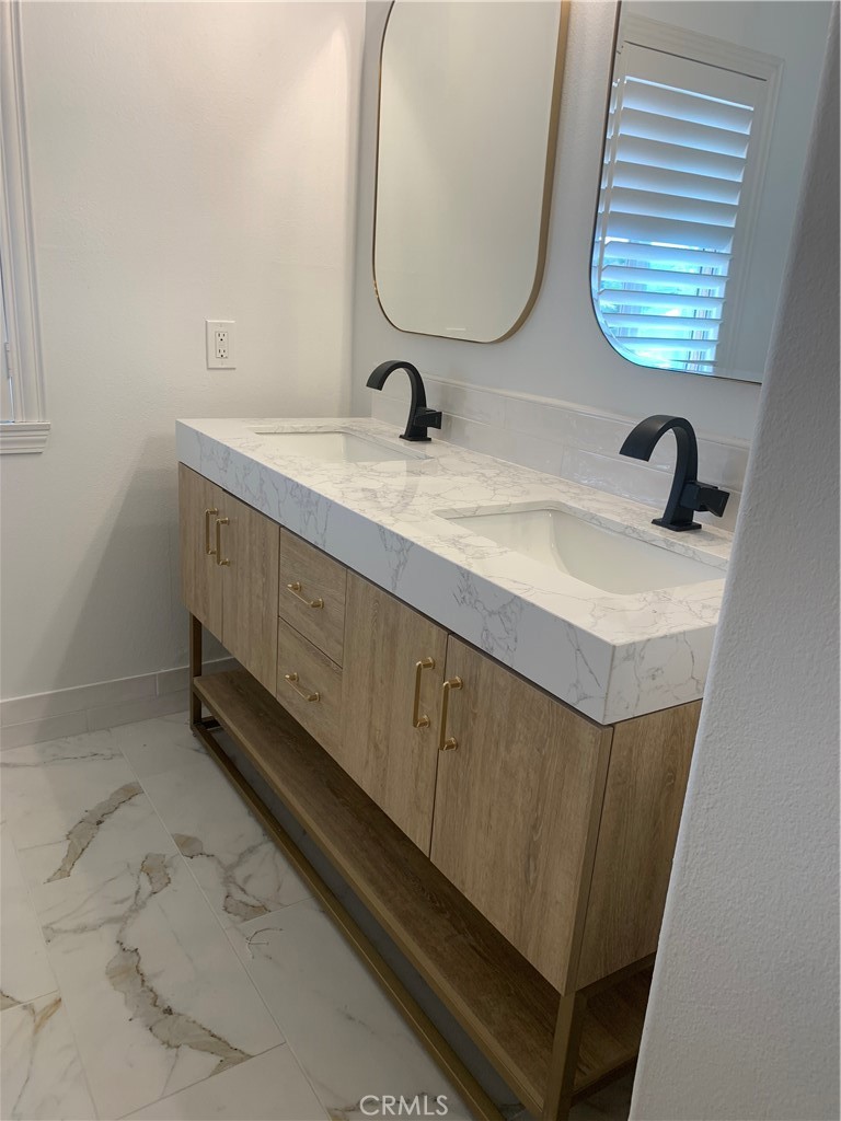 11105 Means Tustin, CA 92782 - Photo 17 of 23 a bathroom with a sink and a mirror