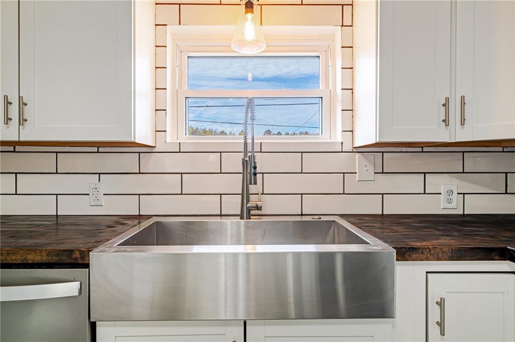 1109 Baggaley Avenue Latrobe, PA 15650 - Photo 12 of 36 a view of a kitchen counter top a stove a sink and a window