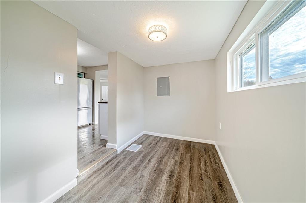 1109 Baggaley Avenue Latrobe, PA 15650 - Photo 13 of 36 a view of a room with wooden floor and a window