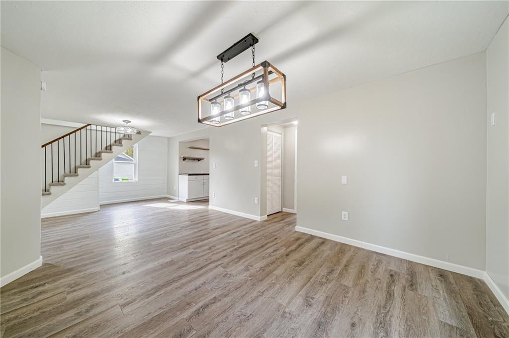 1109 Baggaley Avenue Latrobe, PA 15650 - Photo 7 of 36 a view of an empty room with wooden floor and windows
