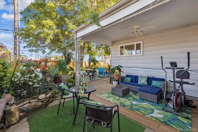 a view of a patio with chairs and a table
