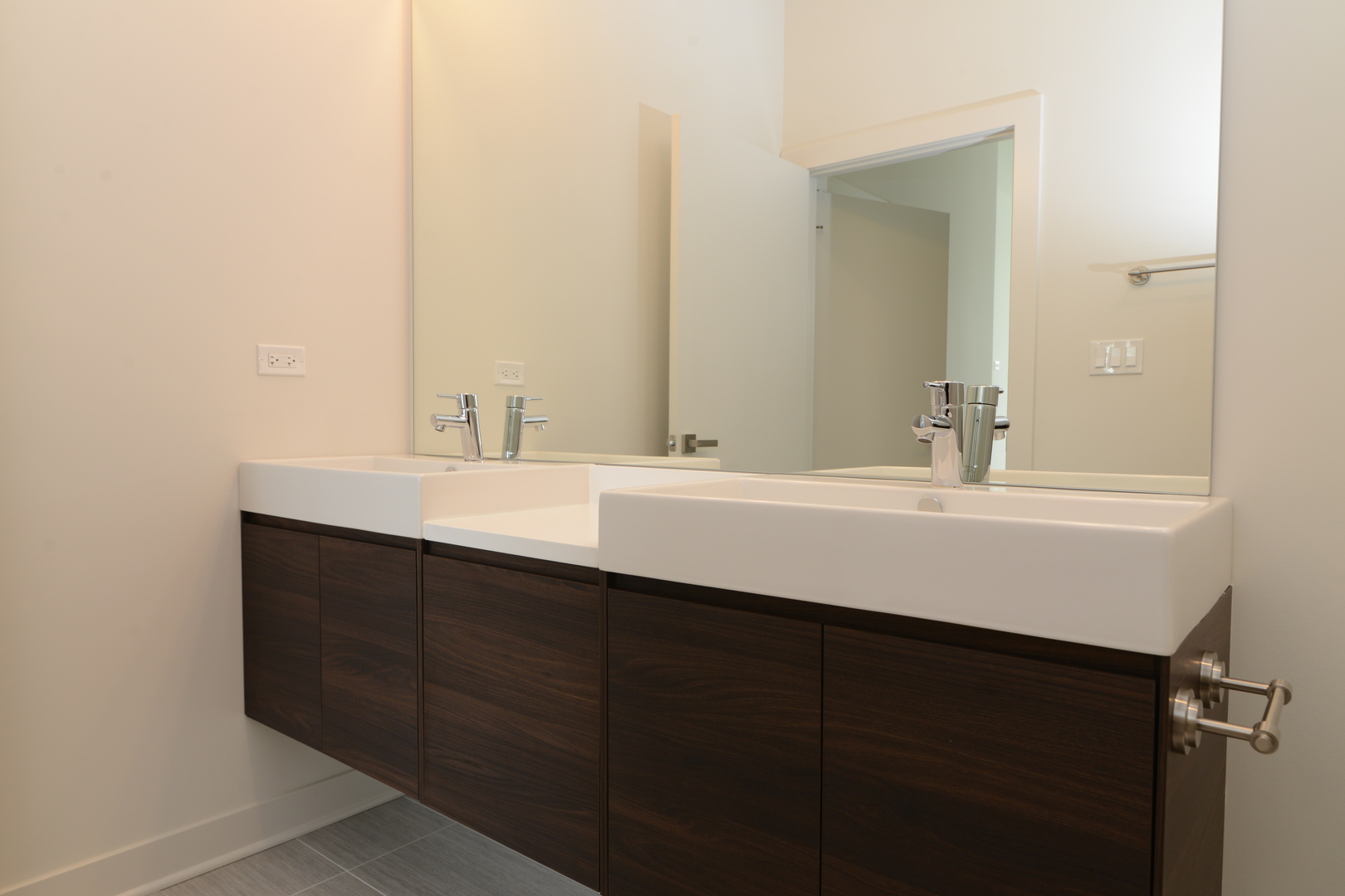 858 North Franklin Street, Unit 503 Chicago, IL 60610 - Photo 6 of 9 a bathroom with a sink and a mirror