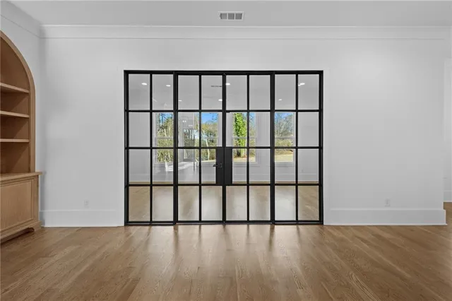 a view of walk in closet with empty racks