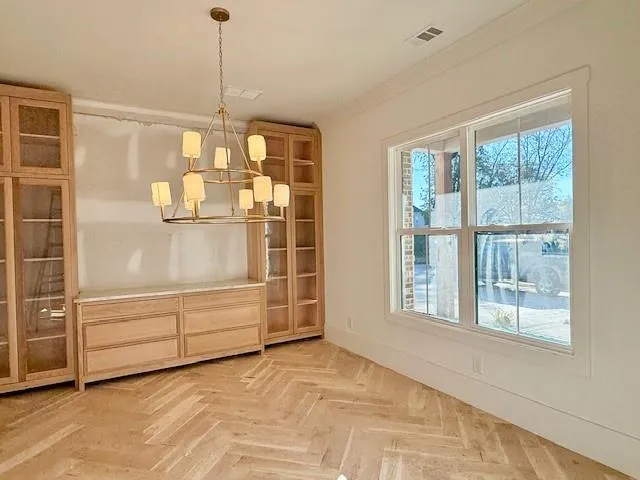 a kitchen with kitchen island a sink a center island stainless steel appliances and cabinets