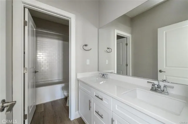 a bathroom with a sink a shower and a mirror