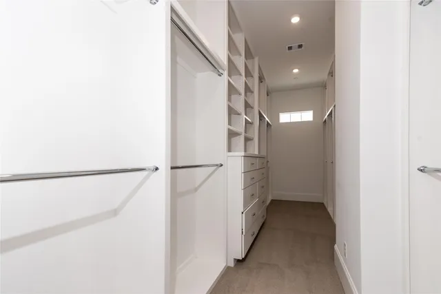 a view of a hallway with white walls