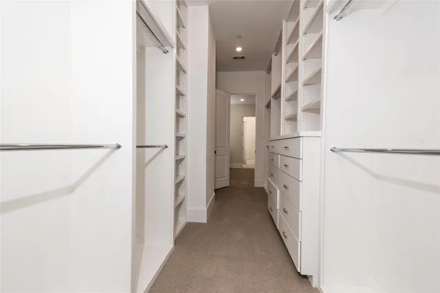 a view of a hallway with a white walls