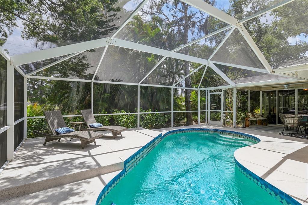 3757 Countryside Road Sarasota, FL 34233 - Photo 28 of 34 a view of a house with backyard and sitting area