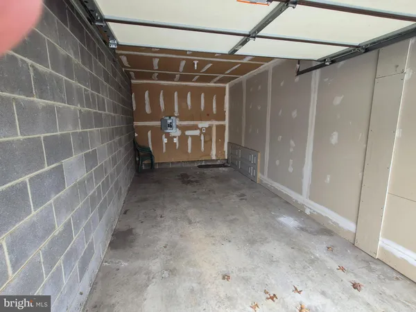 view of living room with a fireplace furniture and a large window