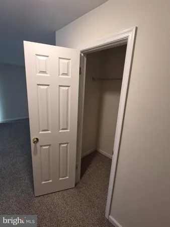 view of a utility room with closet