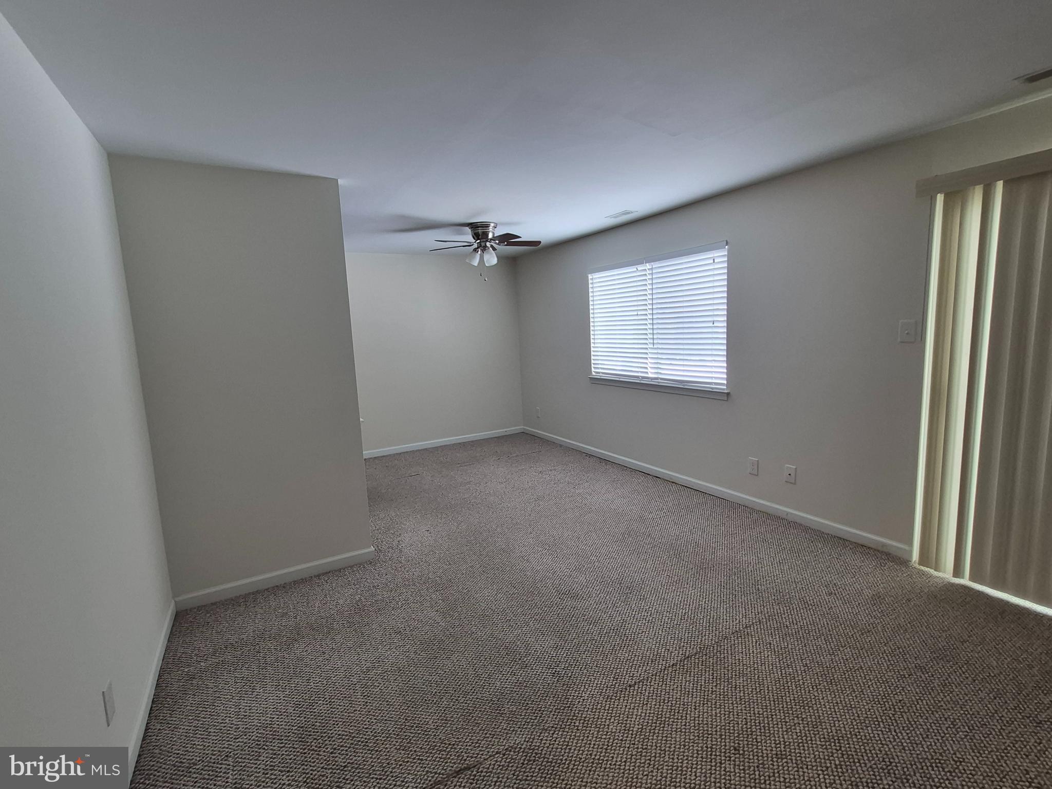 17 Sandra Road Voorhees, NJ 08043 - Photo 3 of 14 an empty room with windows