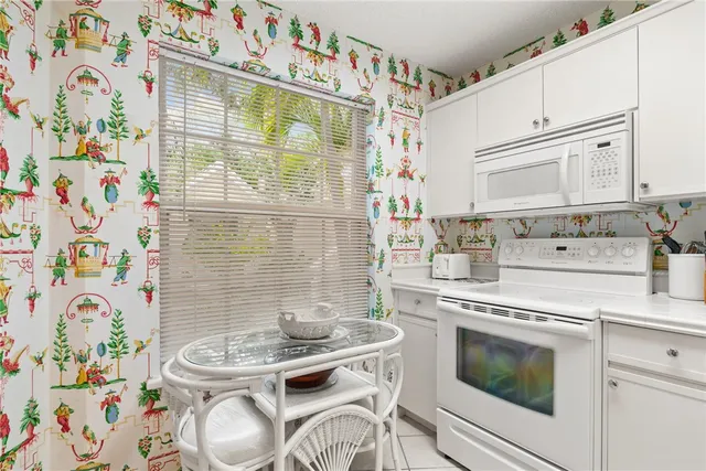a kitchen with a stove and a table