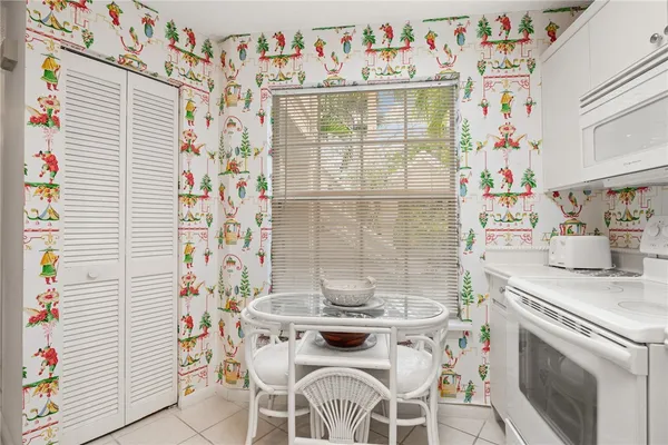 a kitchen with a stove and a table