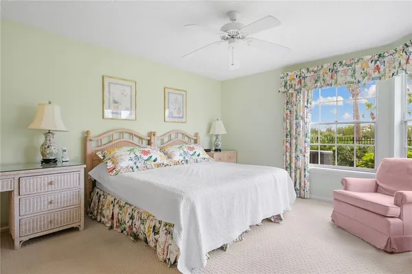 a bedroom with a bed a couch and dresser