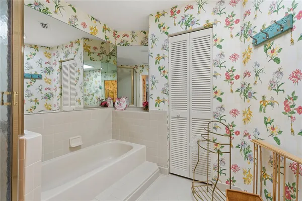 a bathroom with a bathtub and shower curtain