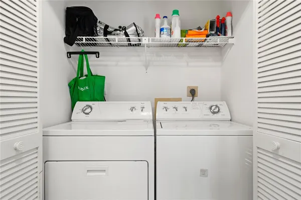 a utility room with dryer and washer
