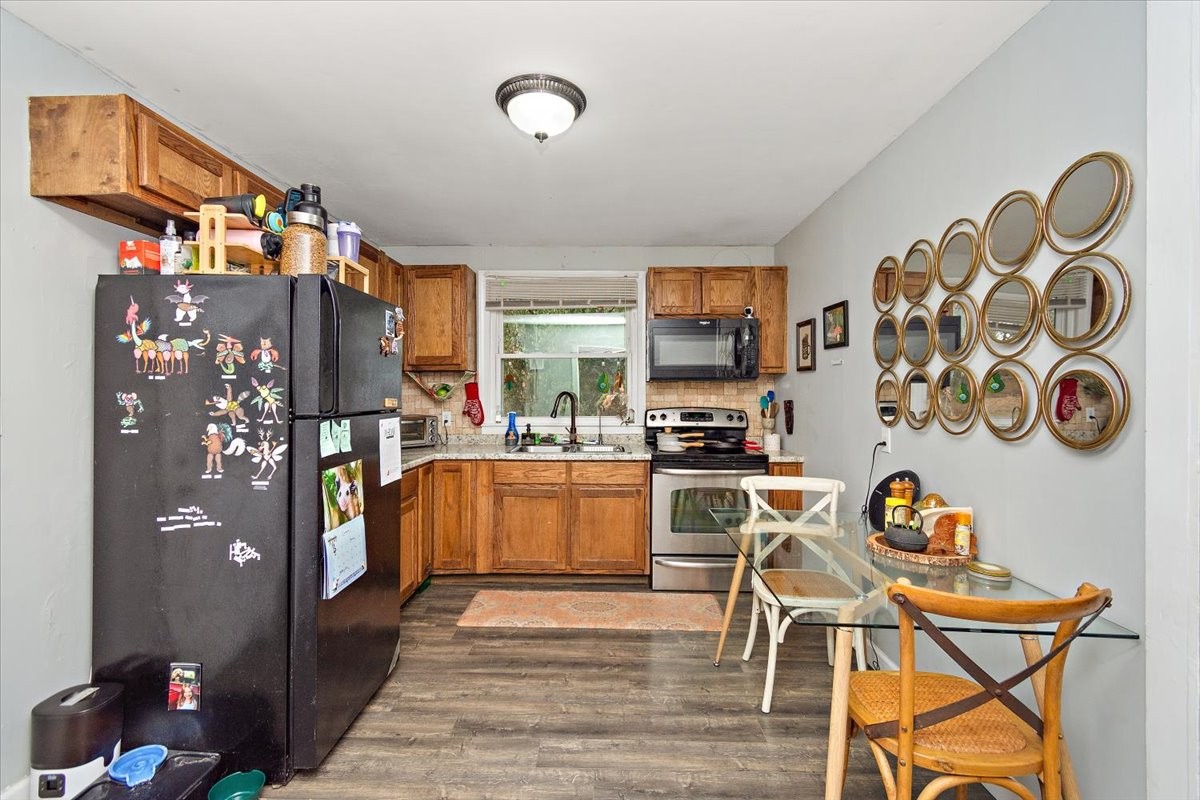 1081 Slaters Creek Road Goodlettsville, TN 37072 - Photo 8 of 22 a kitchen with stainless steel appliances granite countertop a refrigerator and a stove top oven
