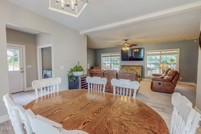 a living room with furniture wooden floor and a fireplace